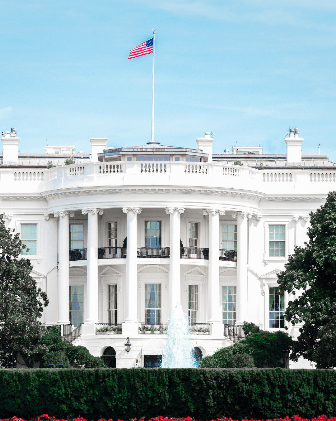 White House with American flag representing US-UK tax expertise