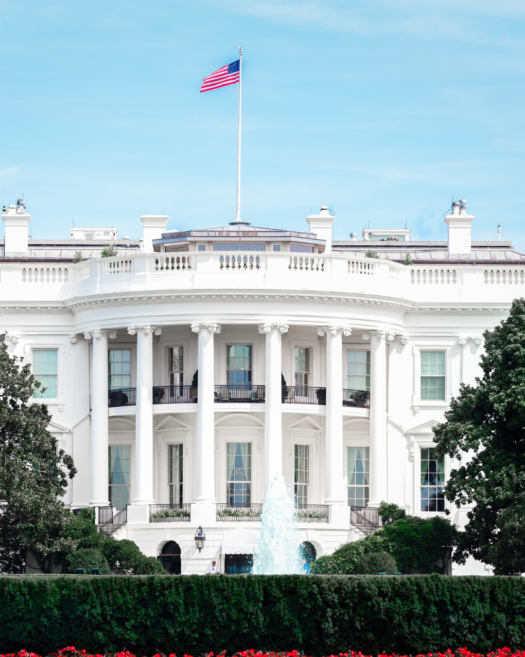 White House with American flag representing US-UK tax expertise